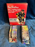 Binder front and two stacks of hockey cards