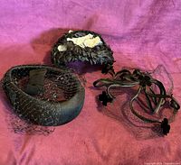 All three headpieces grouped on fabric background