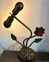 Full view of sculptural metal rose lamp unlit