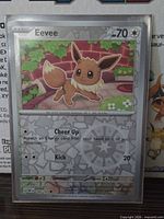 Front of Eevee Reverse Holo card in sleeve