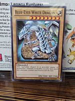 Front view of Blue-Eyes White Dragon card in sleeve
