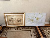 Both artworks side by side on floor showing relative sizes and frames