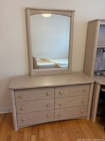 Full view of dresser with attached mirror