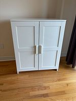 Front view of white shaker cabinet closed