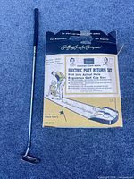 Original Sears electric putt return box and Ping putter