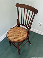 full view of dark brown wooden Windsor chair