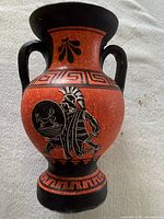 Front view showing warrior black-figure scene and two handles