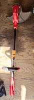 Full view of Homelite corded electric string trimmer on floor