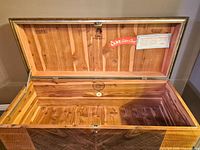 Chest open showing cedar interior, Lane labels, aroma seal