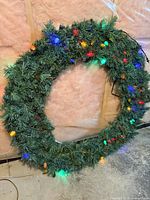 Full view of wreath lit showing size and multicolor LEDs