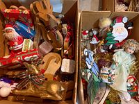 Two boxes filled with assorted Christmas ornaments and figurines