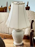 Front view of porcelain lamp with shade