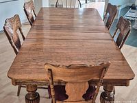 Top view of dining table with seven chairs placed around