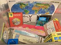 Overall contents in bin: map poster, inflatable globe, poster borders, borders, cutouts, flash cards