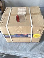 Sealed shipping box showing overall packaging of ATD creeper seat