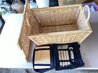 open wicker basket with cooler bag and contents