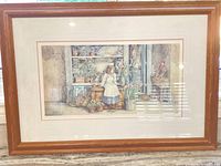 Full view of framed print under glass showing subject and frame