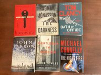 Front covers of all six books laid out
