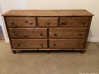 Front view of seven-drawer pine dresser