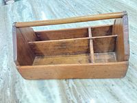 Overall view of wood toolbox showing compartments and handle