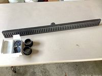 Full drain with hardware and collars on table