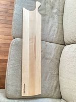 Full view of board front showing overall shape, size, grain and logo