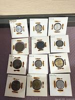 All 11 holders plus one partially visible, showing dates and condition