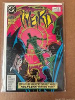 Front cover of "The Weird" #1 in bag with board