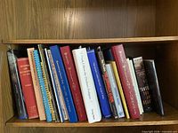 Shelf of approximately 20 Ontario local history and map books