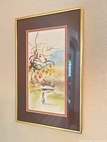 Overall view of framed artwork on wall