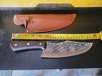 Knife and sheath with tape measure showing length