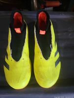Top view of both cleats showing color and design