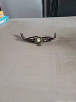 Entire bracelet watch laid flat showing overall design