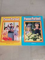 Front of both Passe-Partout VHS volumes