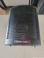 Top view showing Showbox logo and vented grille