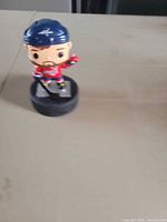 Front view of Washington Capitals bobblehead on puck base