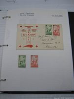 Album page dated 16 Oct 1939 with New Zealand Health first day cover and two loose stamps
