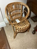 Front view of rattan wicker child’s armchair
