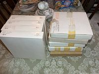 Stack of boxed plates, two stacks showing size and quantity