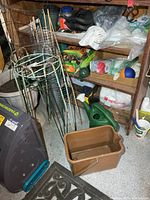 Overview with plant stands, stakes, shelving contents