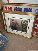 Framed Robert Bateman print leaning against wall