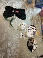 Group shot of all six masks laid on tablecloth