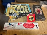 Grouped view of all five boxed items on table