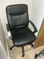 Front angled view showing chair upholstery and armrests