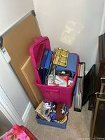 Overall view of boards, pink tote and blue tray on floor