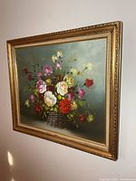 Full view of framed floral oil painting