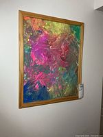 Frontal view of framed abstract painting on wall
