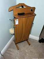 Front view showing oak front panel, hanger, brush, overall design
