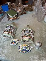 Overall lot view with two wall sconces and four condiment pieces