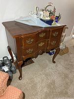 Front and top view of wood server cabinet showing drawers, pulls and overall finish